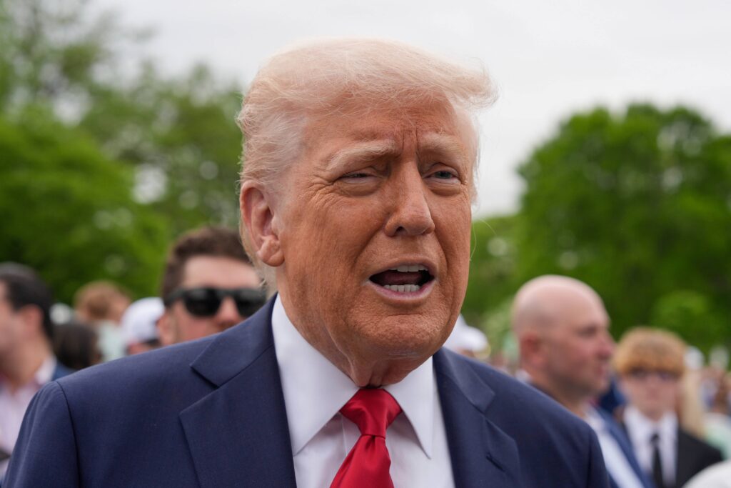 President Donald Trump speaks to reporters on the South Lawn of the White House.