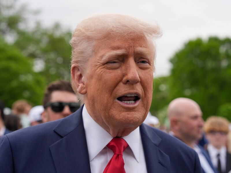 President Donald Trump speaks to reporters on the South Lawn of the White House.