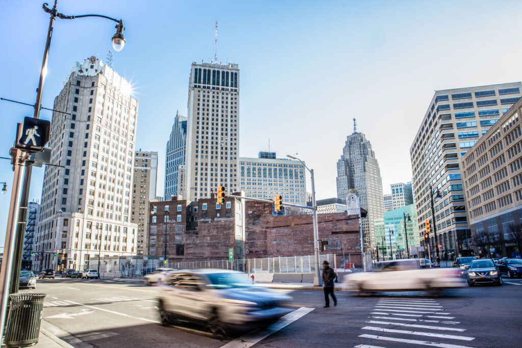 Downtown Detroit street scene on sunny spring day at intersection of Monroe and Randolph.