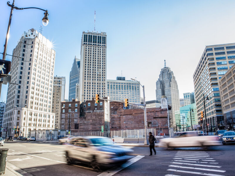 Downtown Detroit street scene on sunny spring day at intersection of Monroe and Randolph.