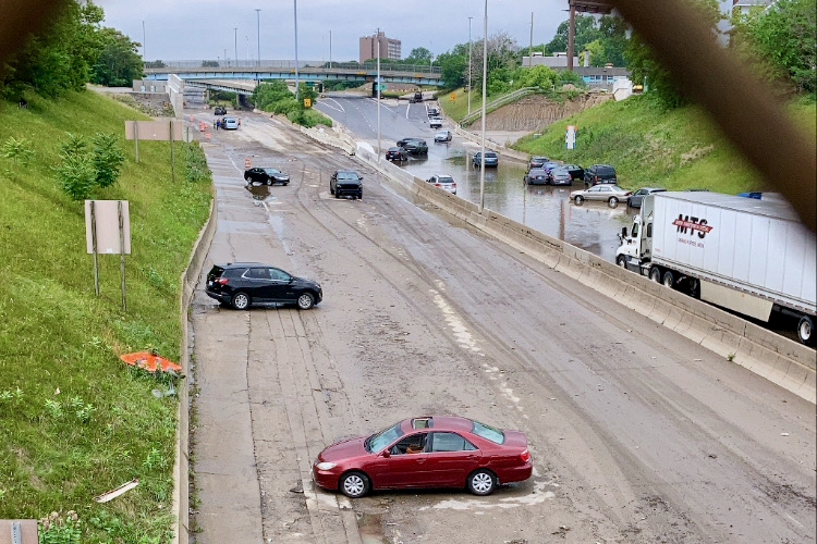 Cars abandoned on I-94 in Detroit after June 2021 flood.