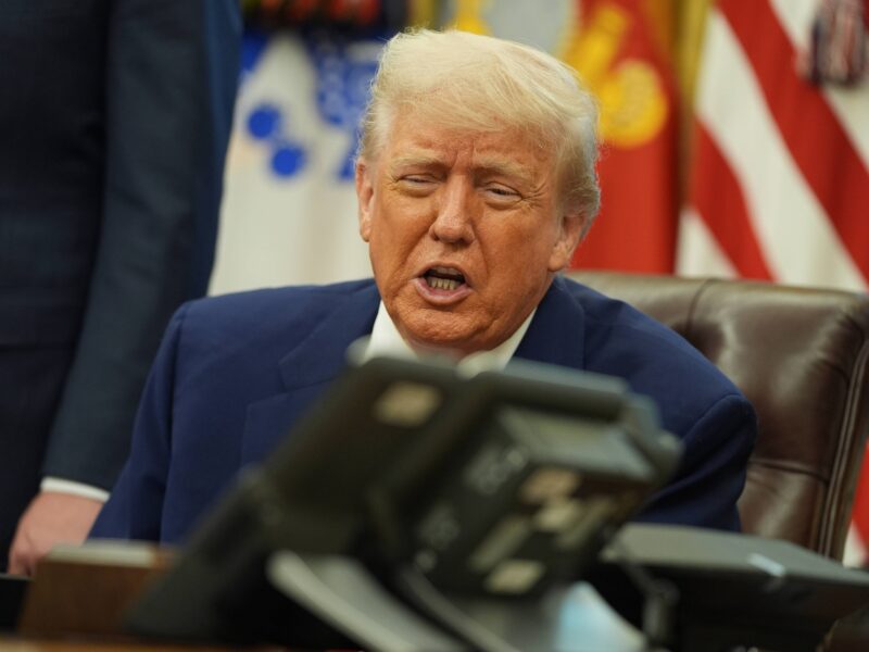 President Donald Trump speaks with British Prime Minister Keir Starmer on a phone in the Oval Office.