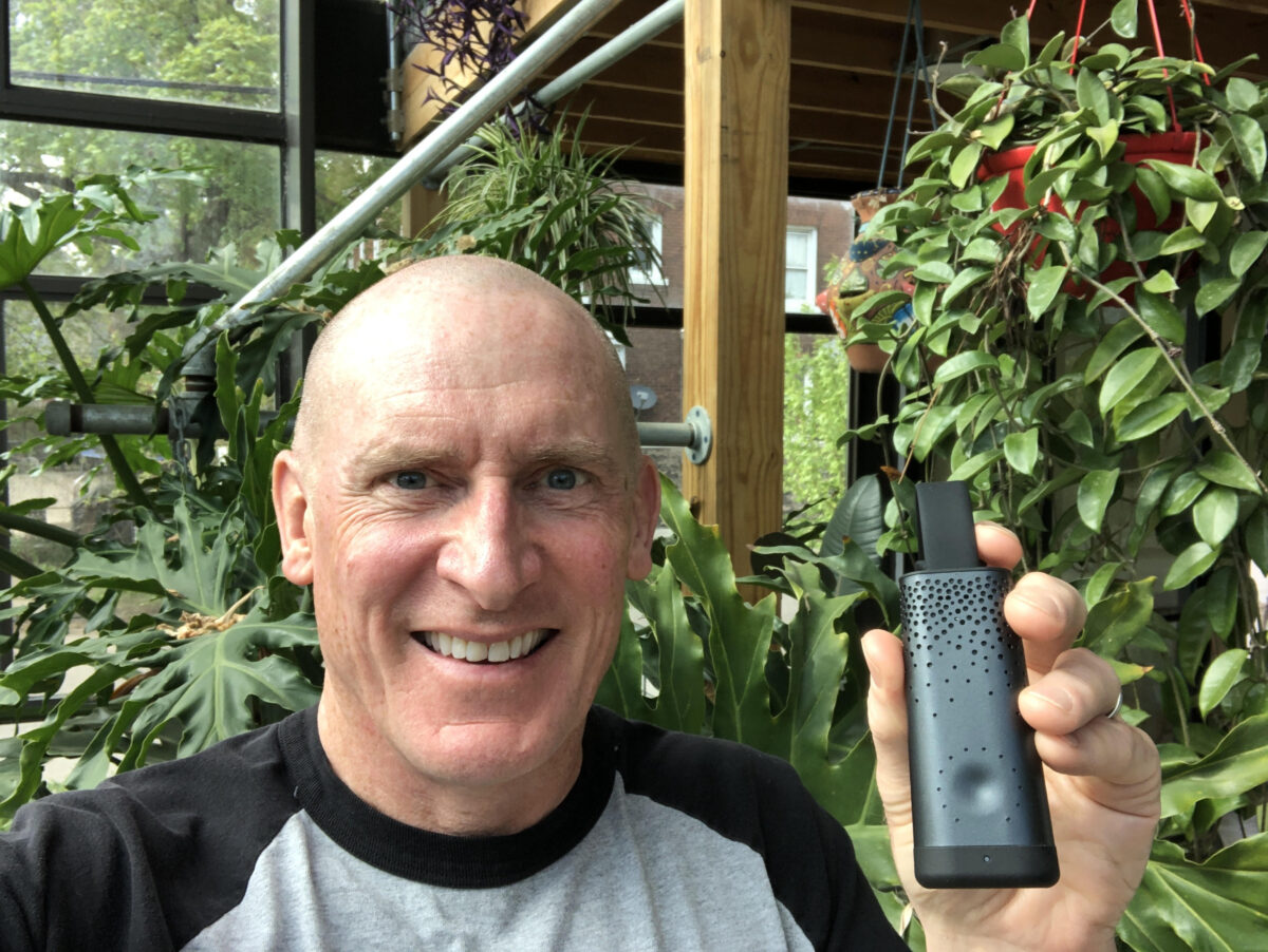 Southwest Detroit resident Ed Gies holds personal air quality monitor.
