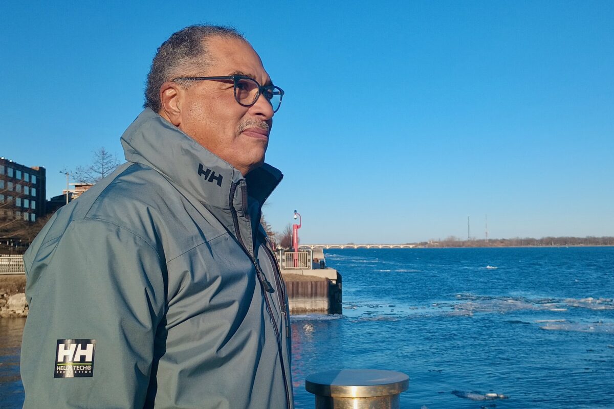 Harry Jones, president of Detroit Community Sailing Center, on the shore of the Detroit River.