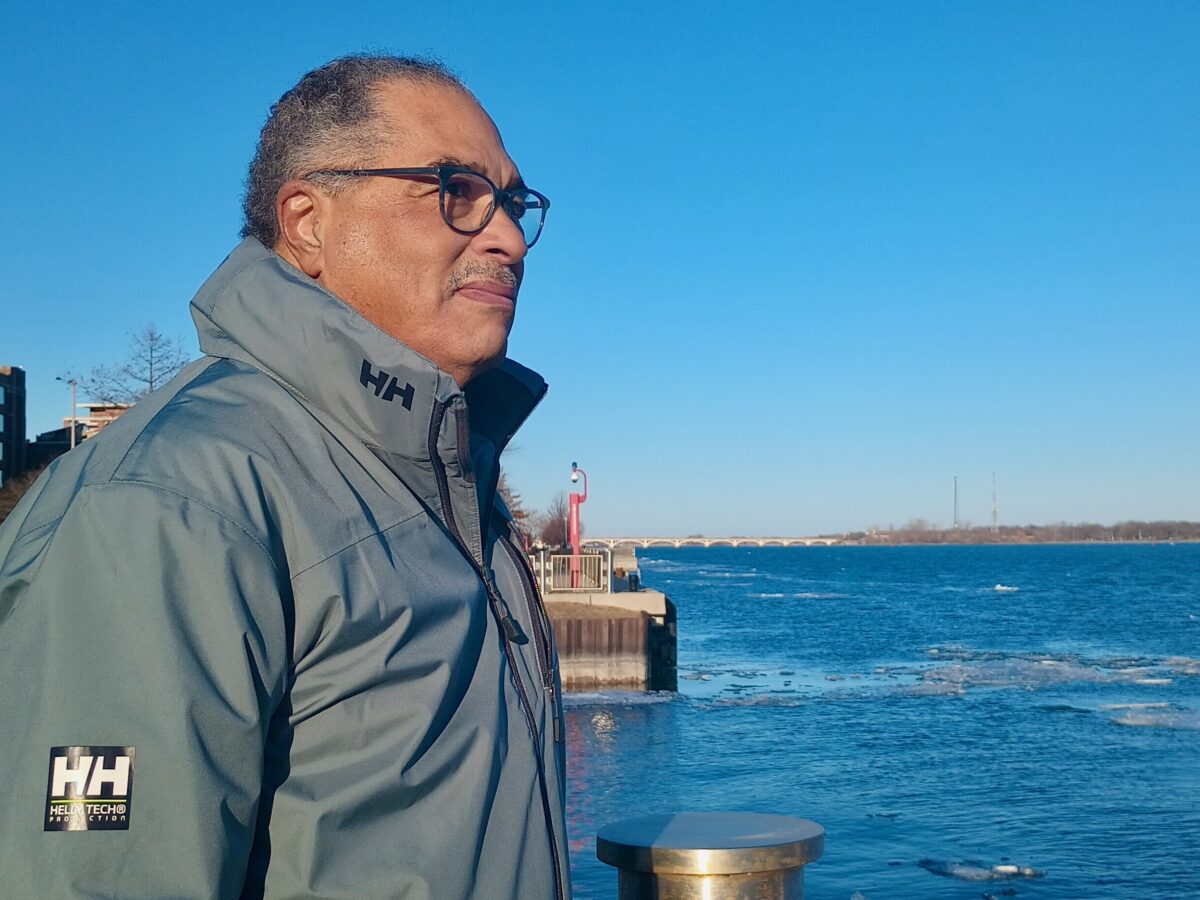 Harry Jones, president of Detroit Community Sailing Center, on the shore of the Detroit River.