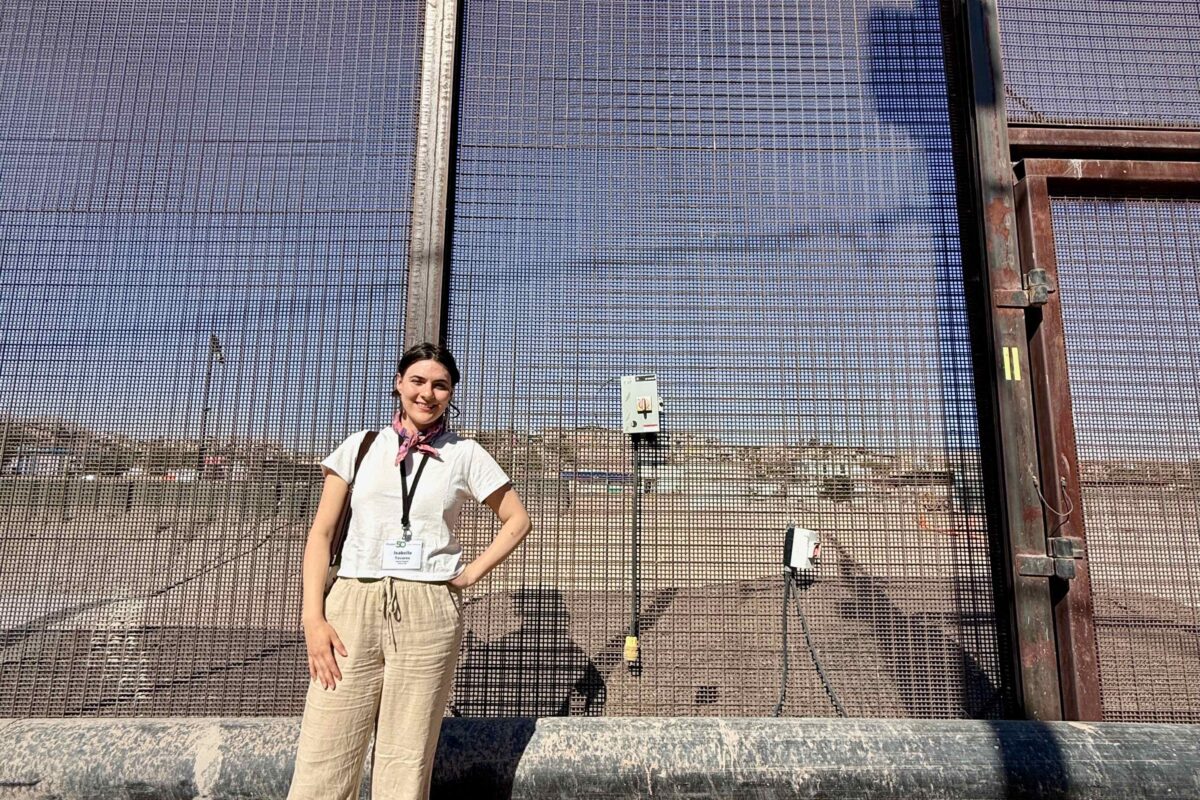 Planet Detroit reporter Isabelle Tavares stands at the U.S.-Mexico border.