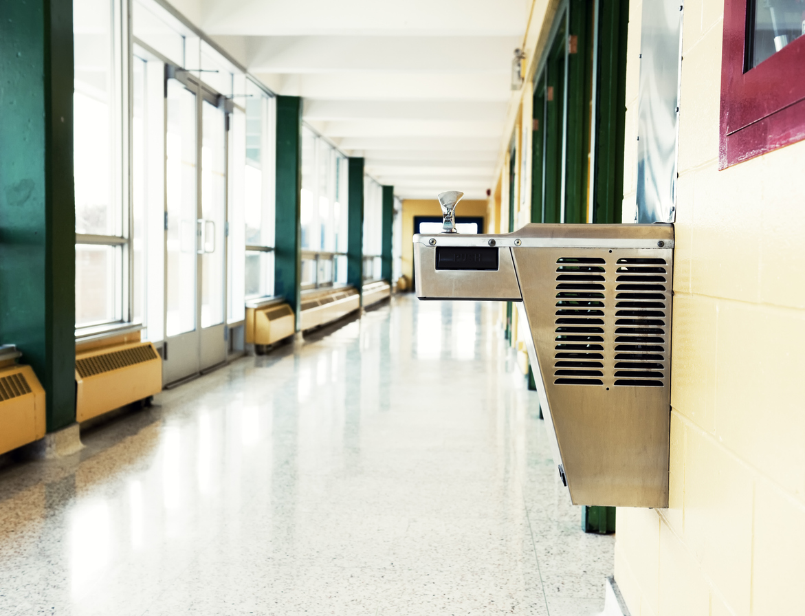 Drinking fountain in a school hallway.