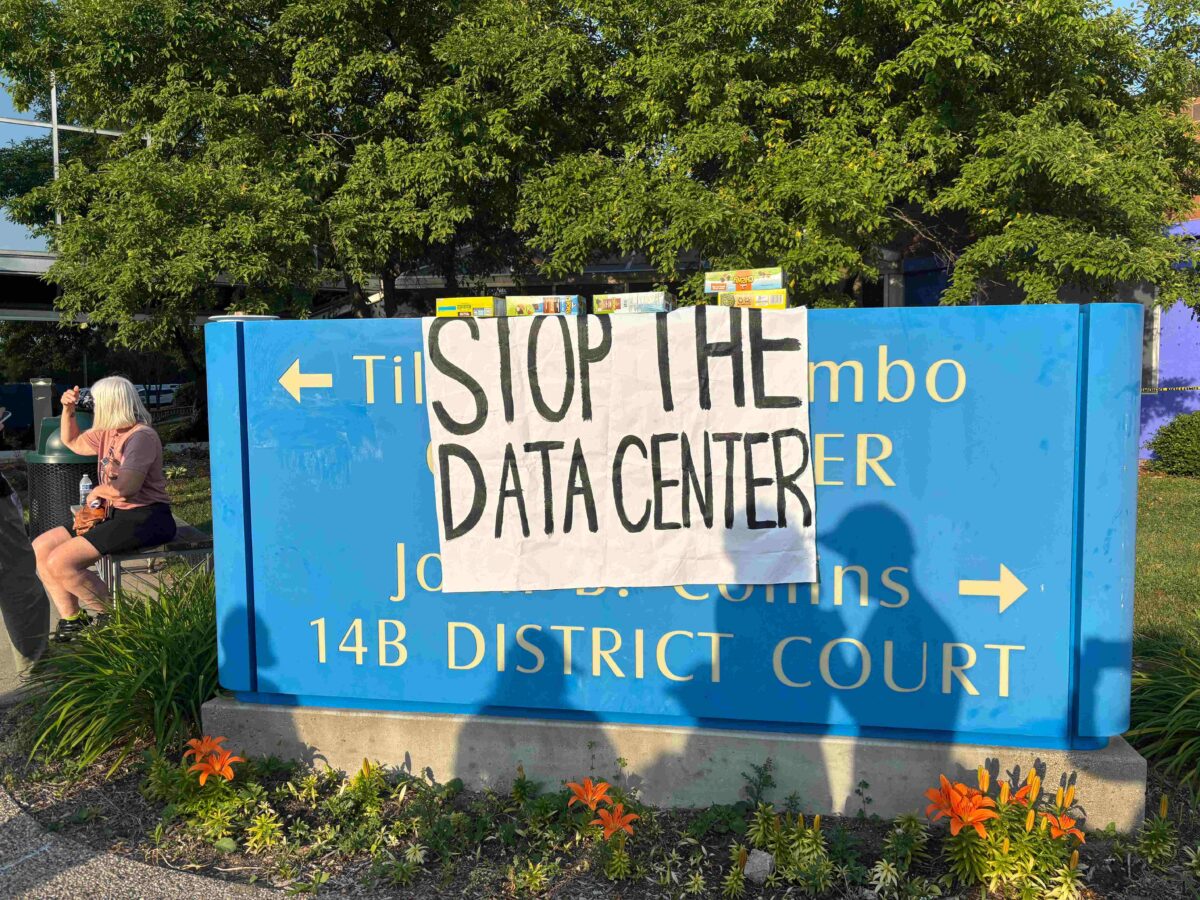 A sign reading "stop the data center" at the Ypsilanti Township Civic Center.