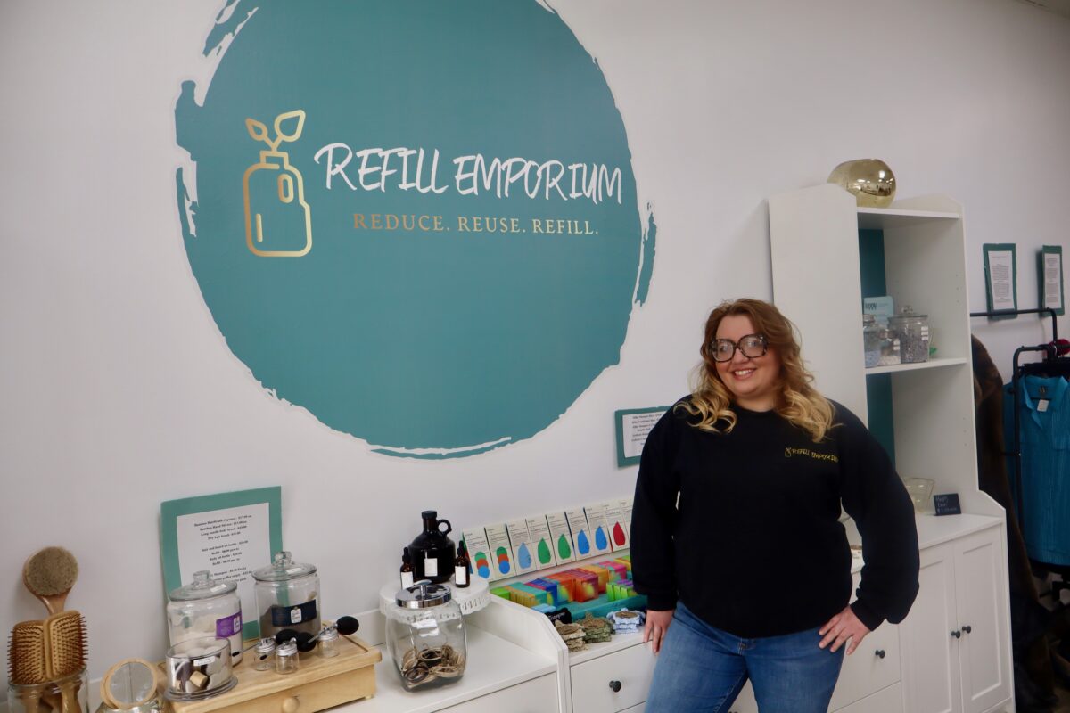 Refill Emporium co-founder Whitney Wagner stands with products in the refillery store.