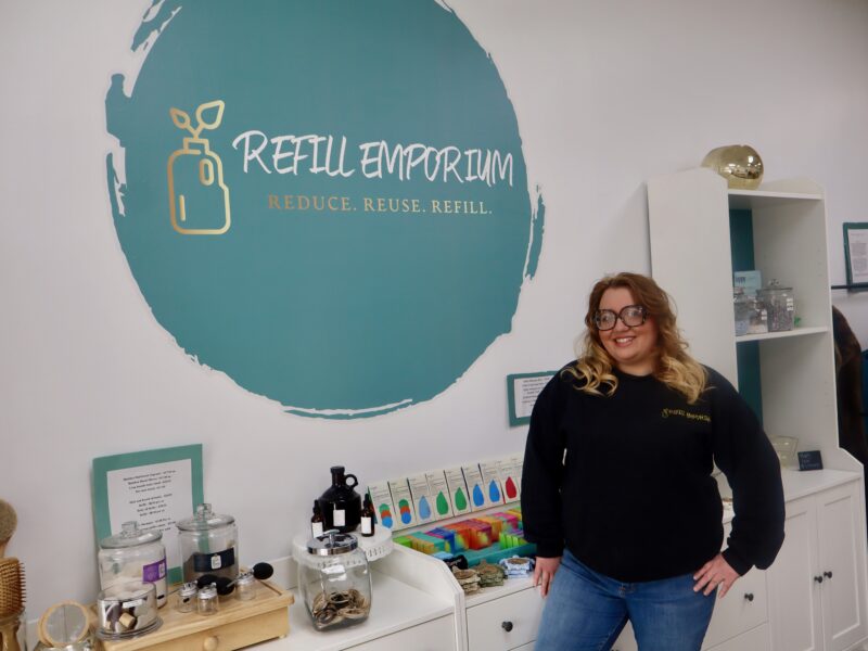 Refill Emporium co-founder Whitney Wagner stands with products in the refillery store.