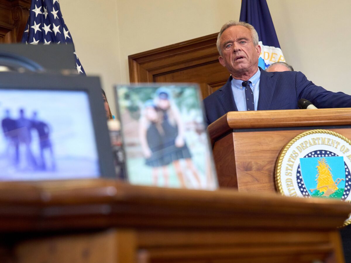 Secretary of Health and Human Services Robert F. Kennedy Jr. speaks from a podium at a press conference.