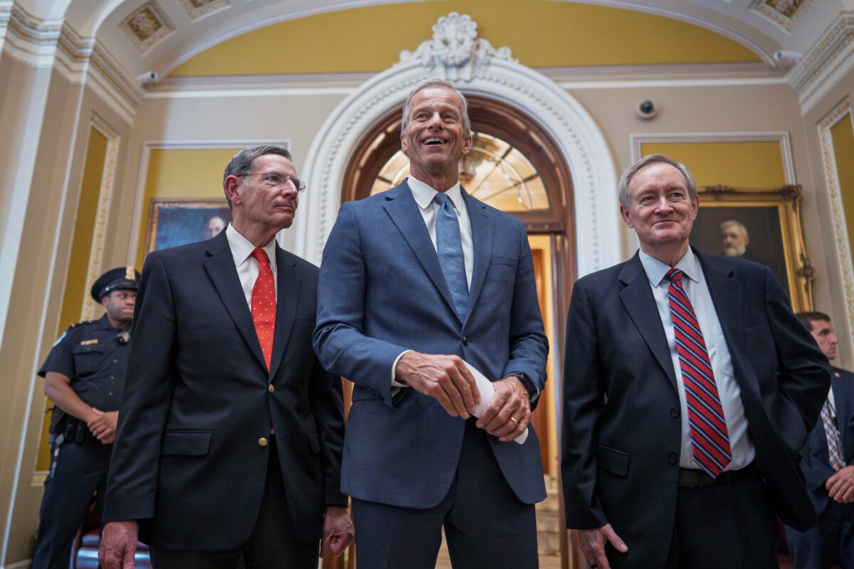 Senate Majority Leader John Thune, R-S.D., is flanked by Sen. John Barrasso, R-Wyo., the GOP whip, left, and Finance Committee Chairman Mike Crapo, R-Idaho, as he speaks to reporters.
