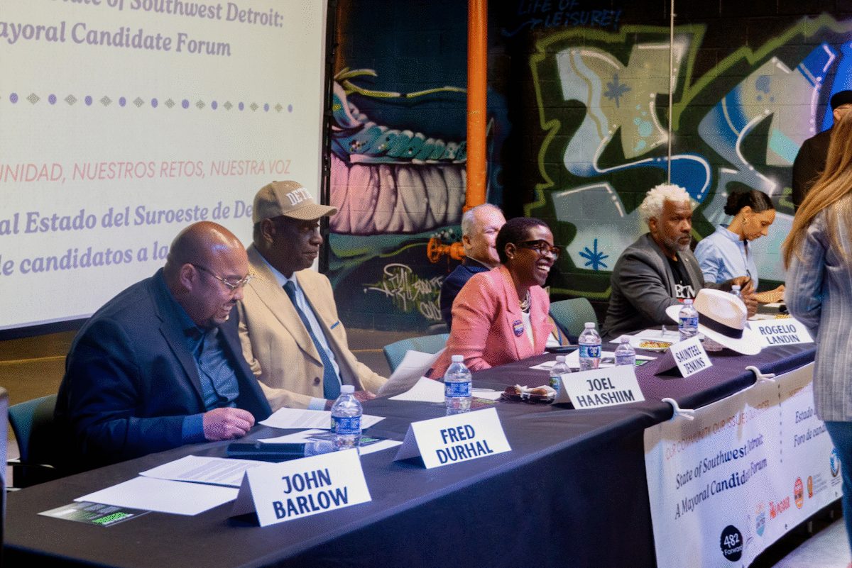 Detroit mayoral candidates seated at table at July 19 forum