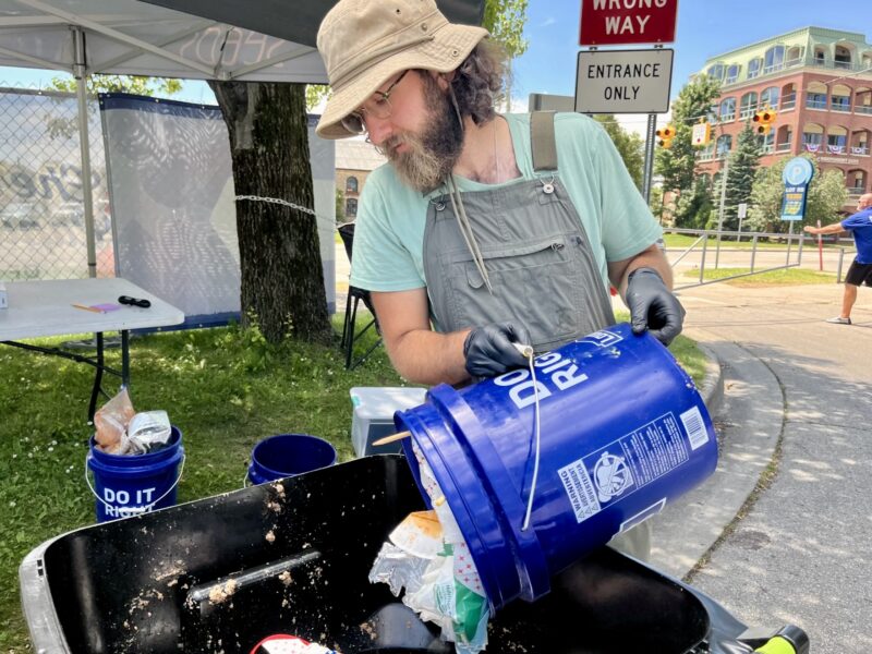 Nick Panicola helps conduct a waste audit of the National Cherry Festival in Traverse City in July 2024.