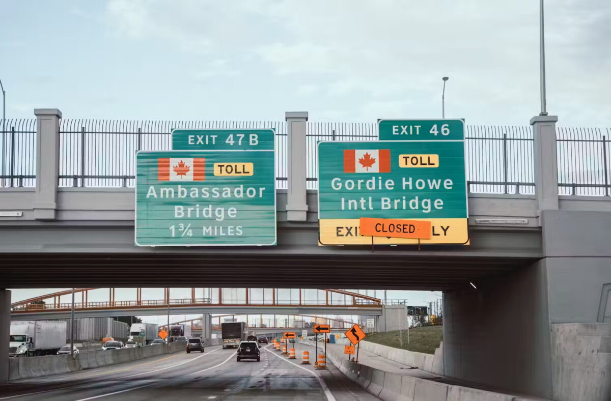 Freeway signs for the Ambassador Bridge and soon-to-open Gordie Howe International Bridge.