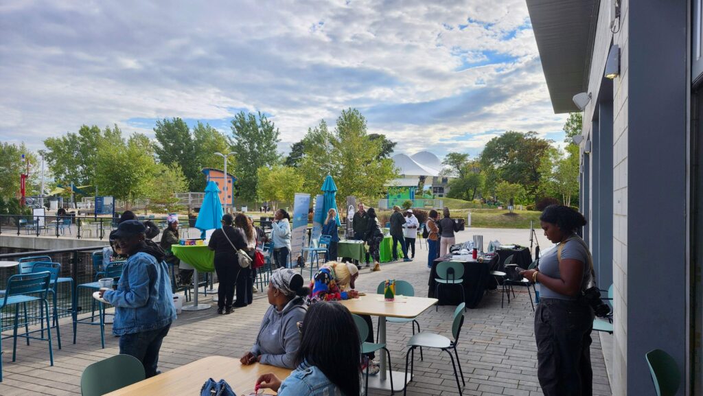 A crowd shot of attendees at the Sustain-A-City exhibition.
