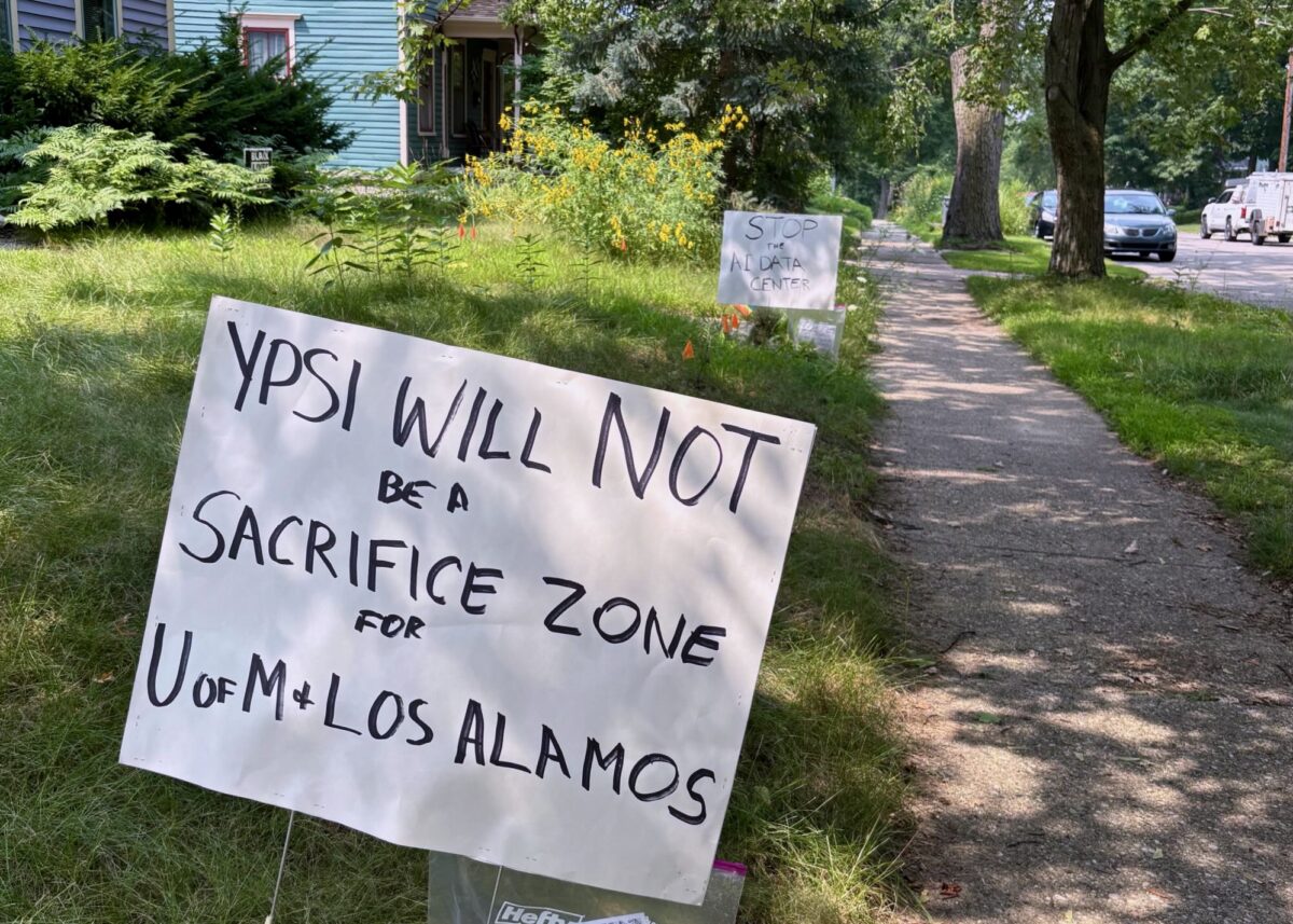 A yard sign in Ypsilanti reads "Ypsi will not be a sacrifice zone for U of M and Los Alamos."