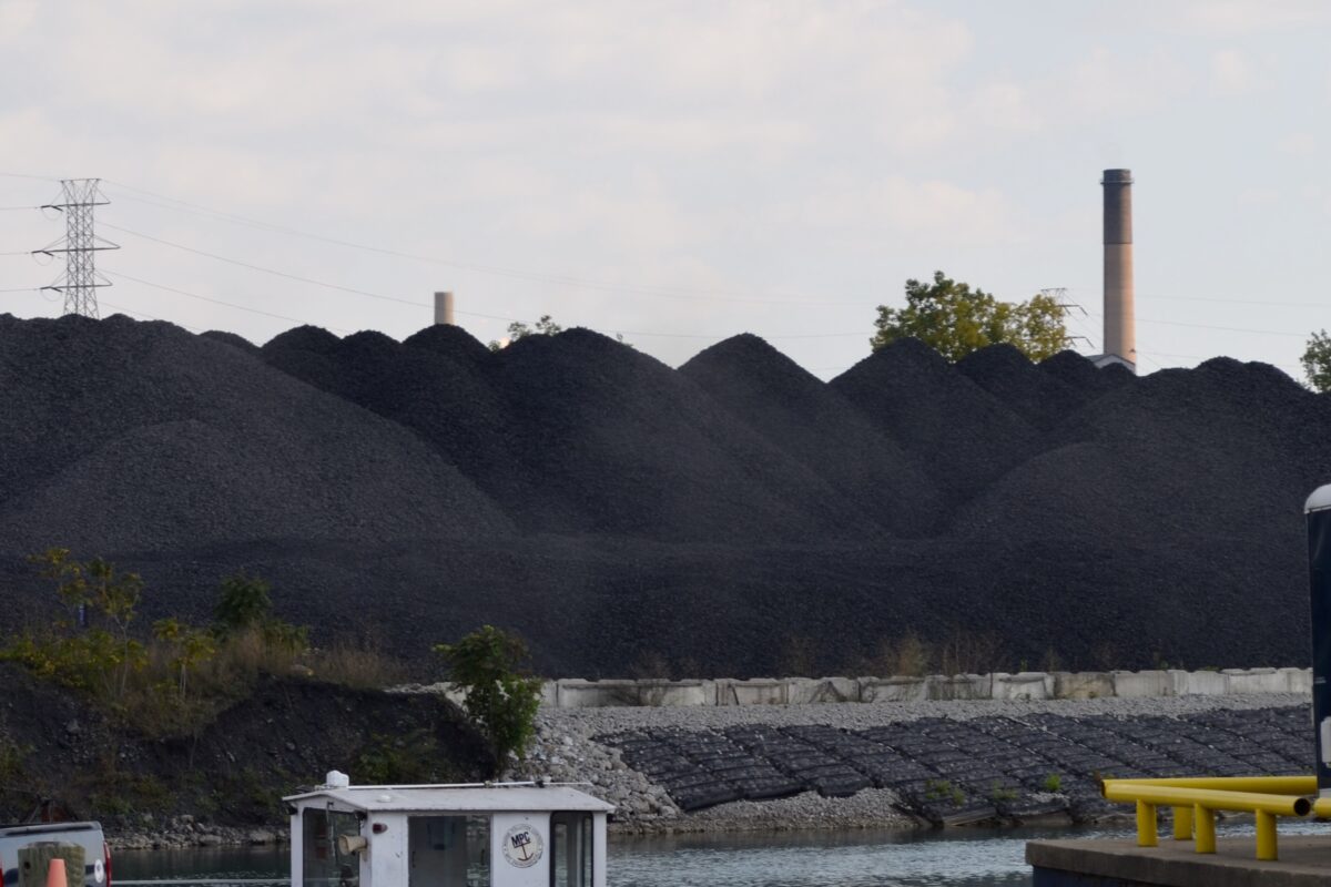 Piles of coal or a similar byproduct or substance are visible on Zug Island, seen from West Jefferson Avenue in Detroit.