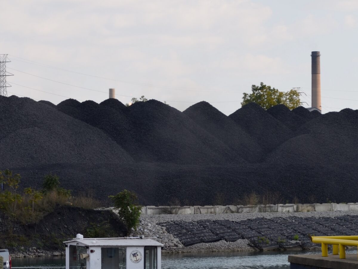 Piles of coal or a similar byproduct or substance are visible on Zug Island, seen from West Jefferson Avenue in Detroit.
