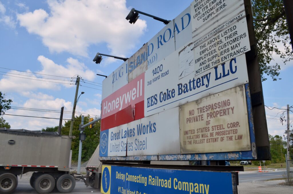 The sign at Zug Island Road and West Jefferson Avenue in Detroit that lists businesses including EES Coke Battery.