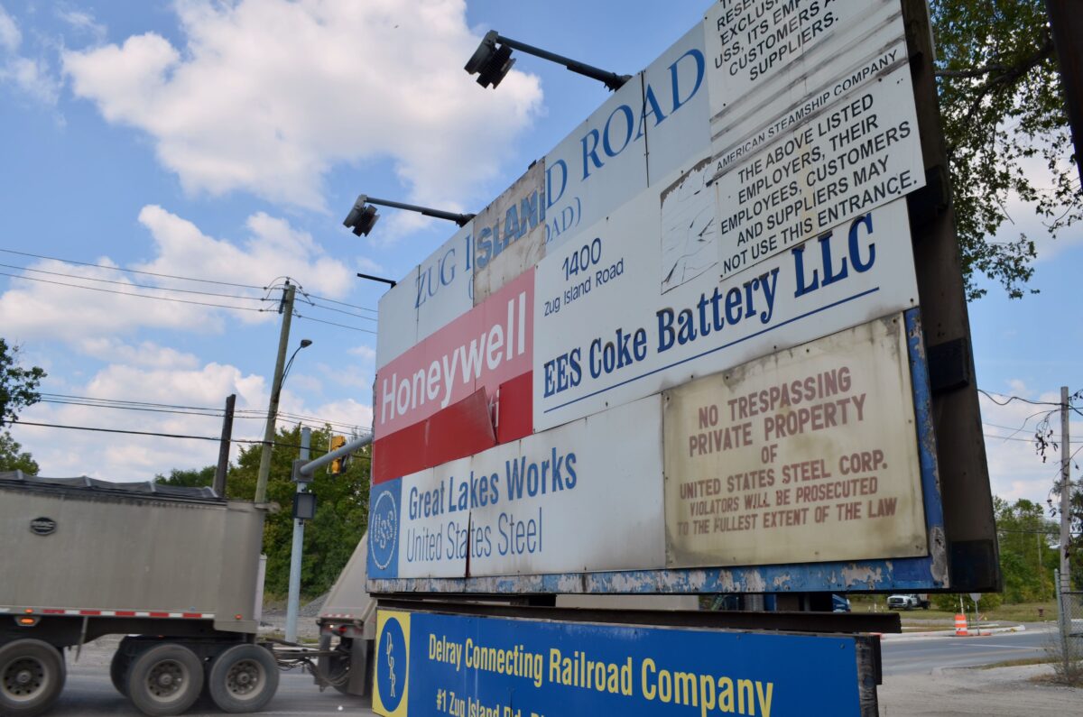 The sign at Zug Island Road and West Jefferson Avenue in Detroit that lists businesses including EES Coke Battery.