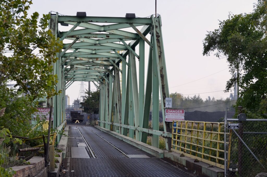 The green swing bridge on the west side of Zug Island.