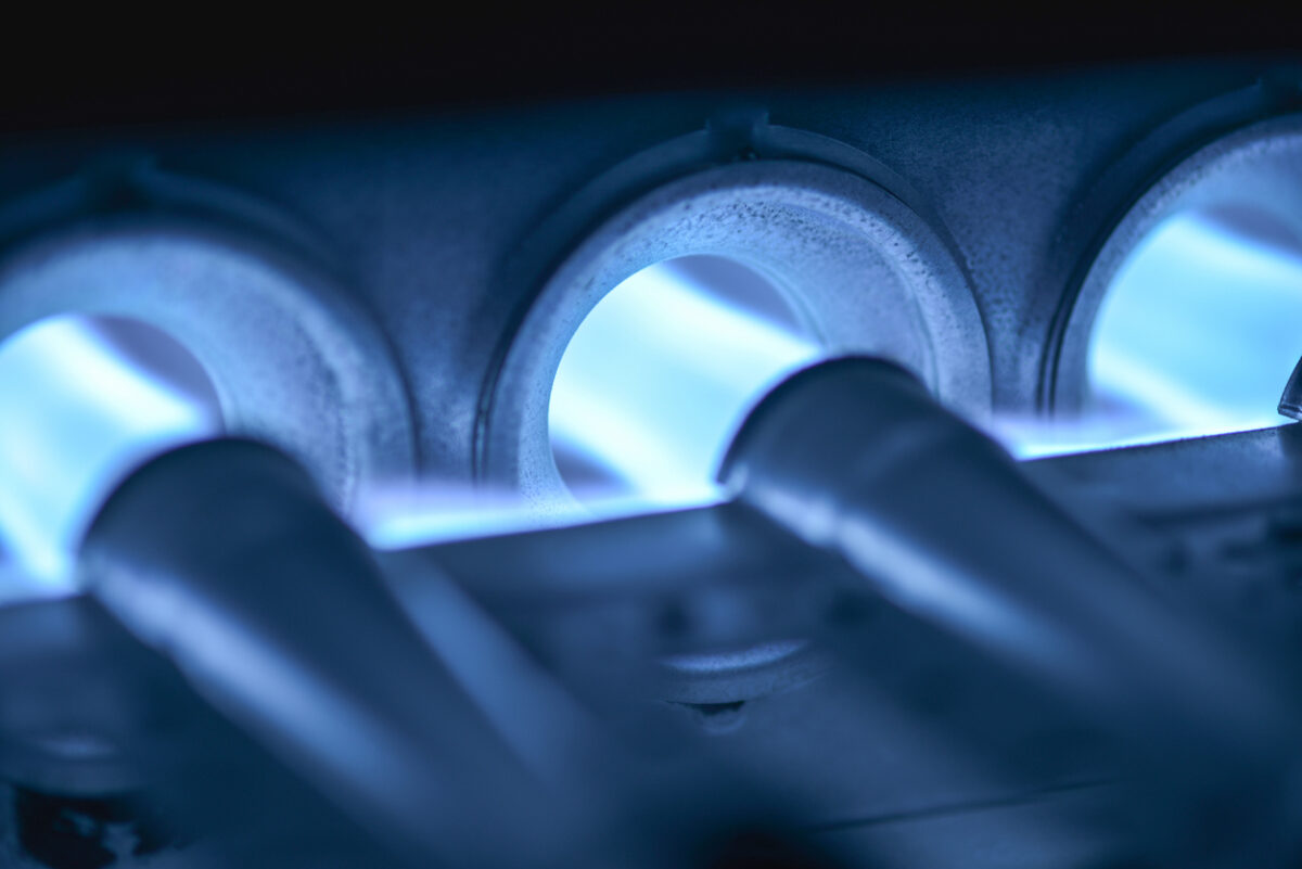 Burners on a home furnace ignite