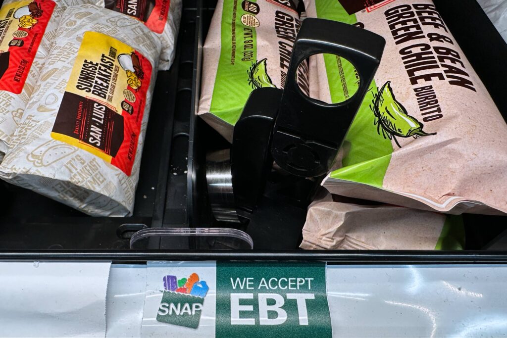 A SNAP EBT sign is displayed on a shelf