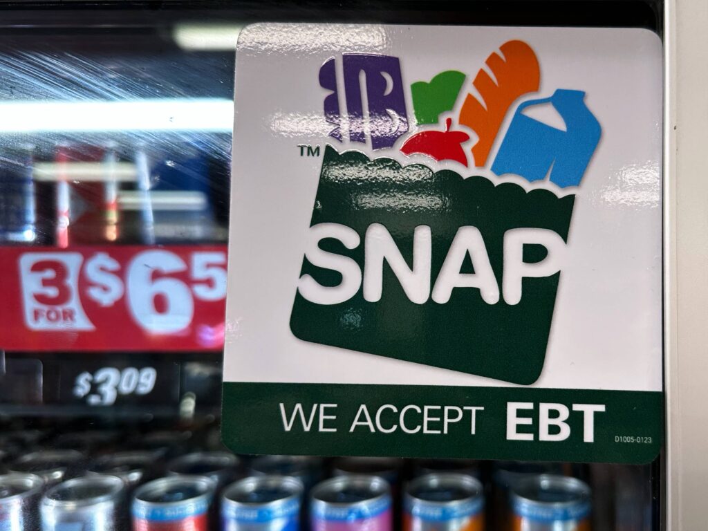 SNAP EBT information sign is displayed at a gas station.