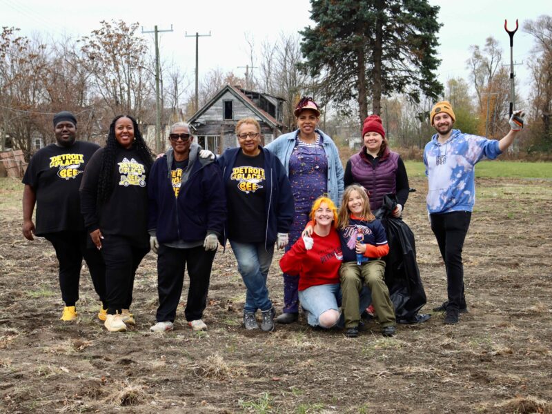Volunteers and representatives of Detroit Hive and Earthday,org at a cleanup on East Warren Avenue.