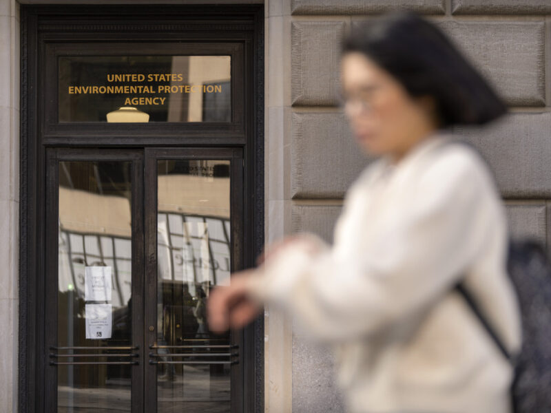 A person walks past the Environmental Protection Agency headquarters