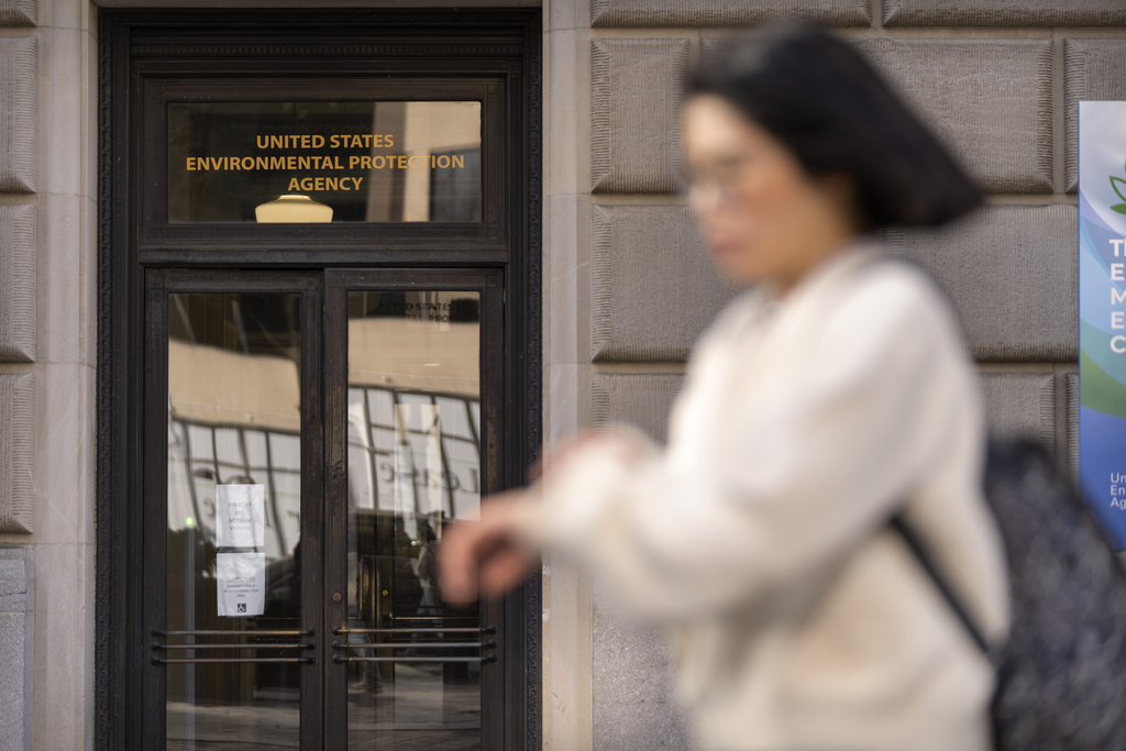 A person walks past the Environmental Protection Agency headquarters