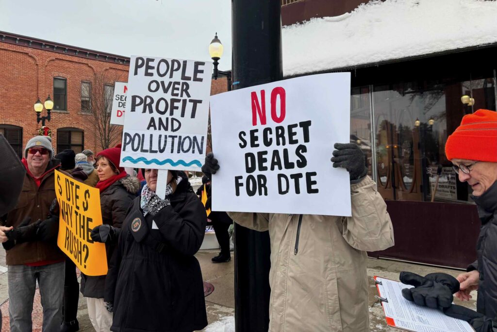 Protesters gather in downtown Saline Monday, Dec. 1 to oppose the Saline Township data center.