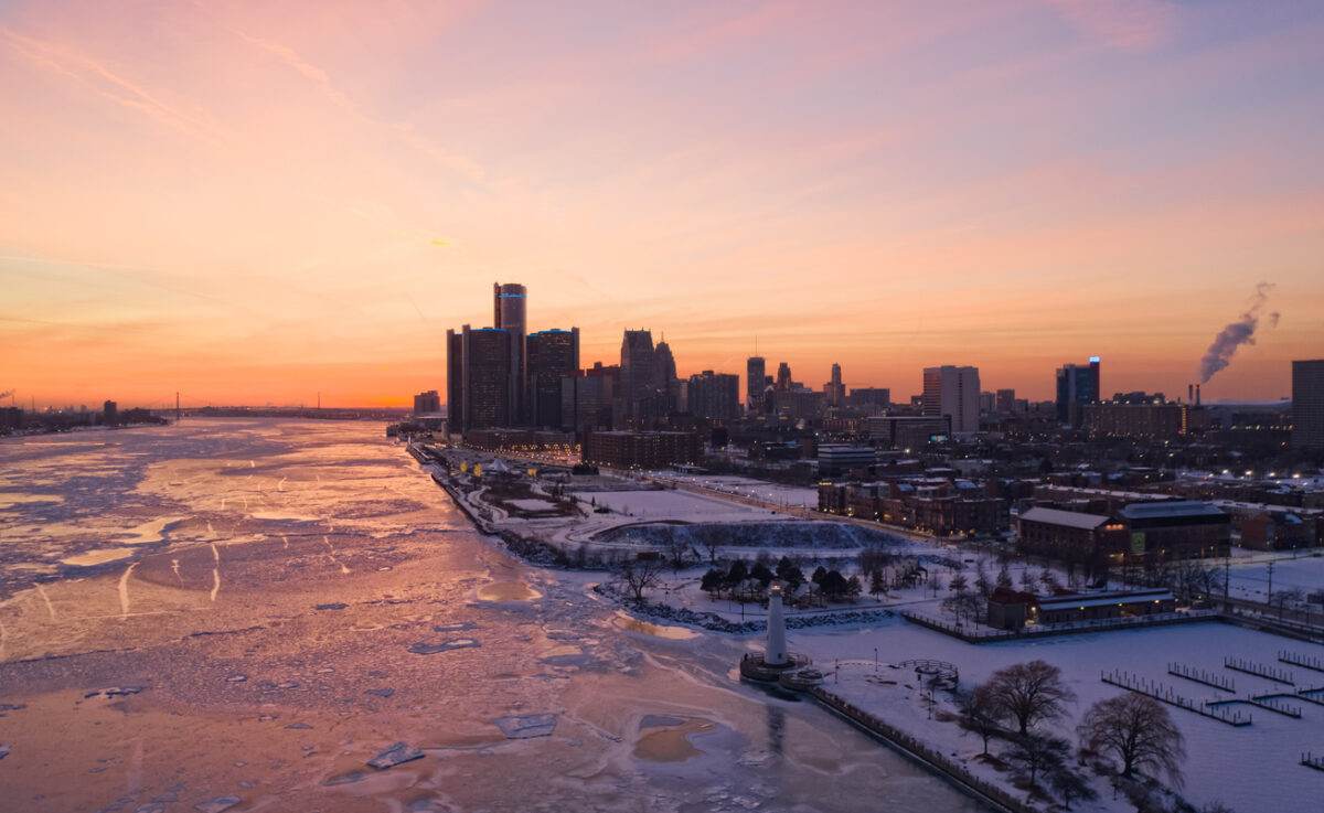 Sunset over the Detroit River and downtown skyline in winter.
