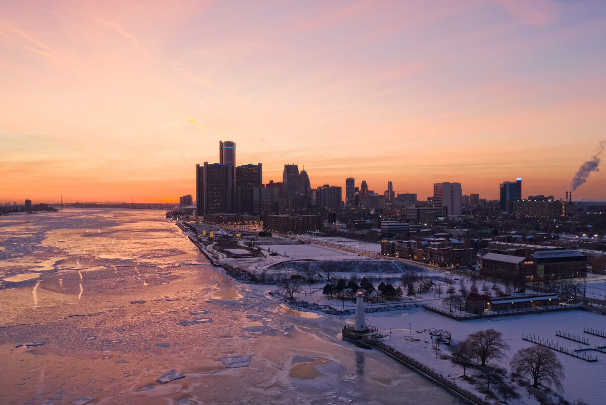 Sunset over the Detroit River and downtown skyline in winter.