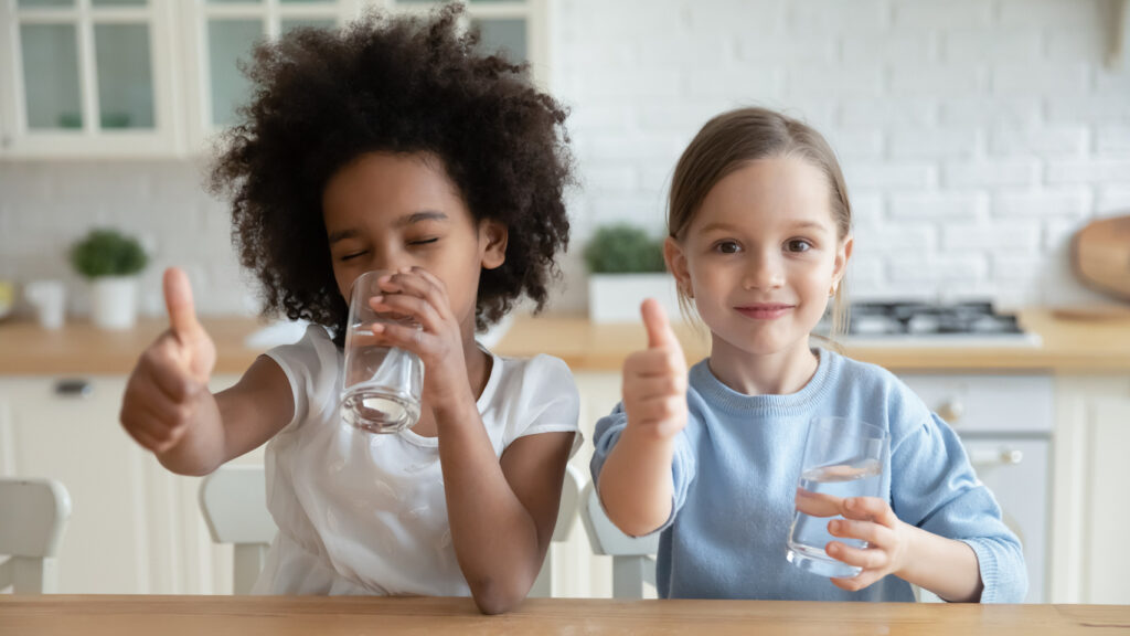 Children enjoying drinking water.