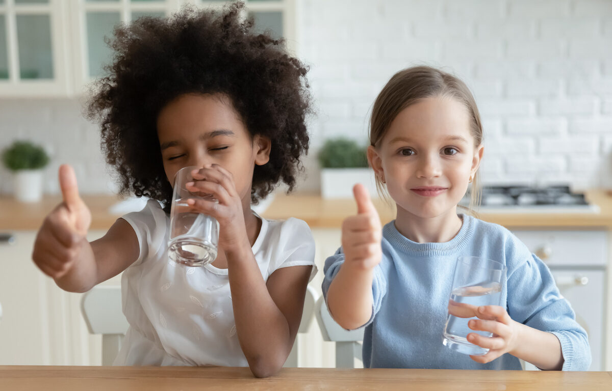 Children enjoying drinking water.