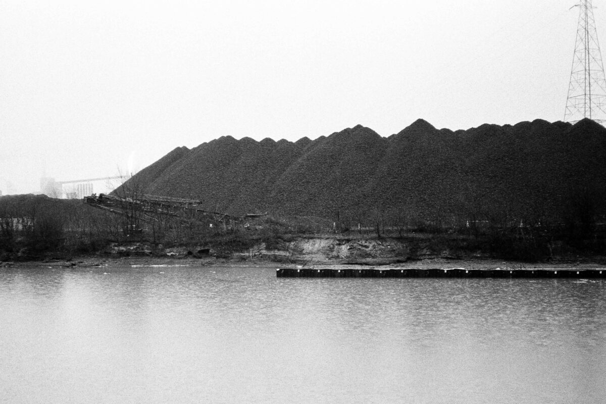 A black-and-white image of the Zug Island shoreline