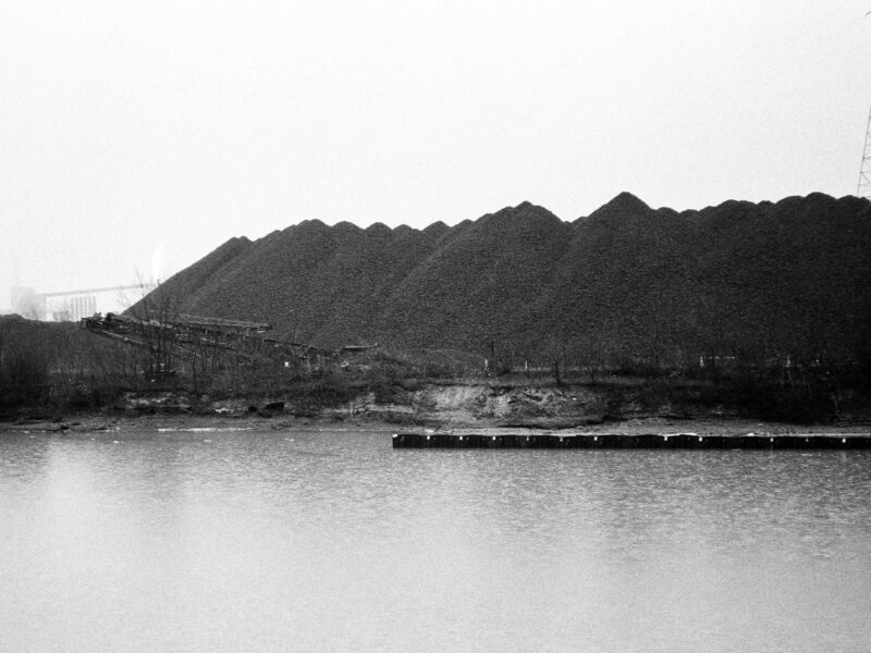 A black-and-white image of the Zug Island shoreline