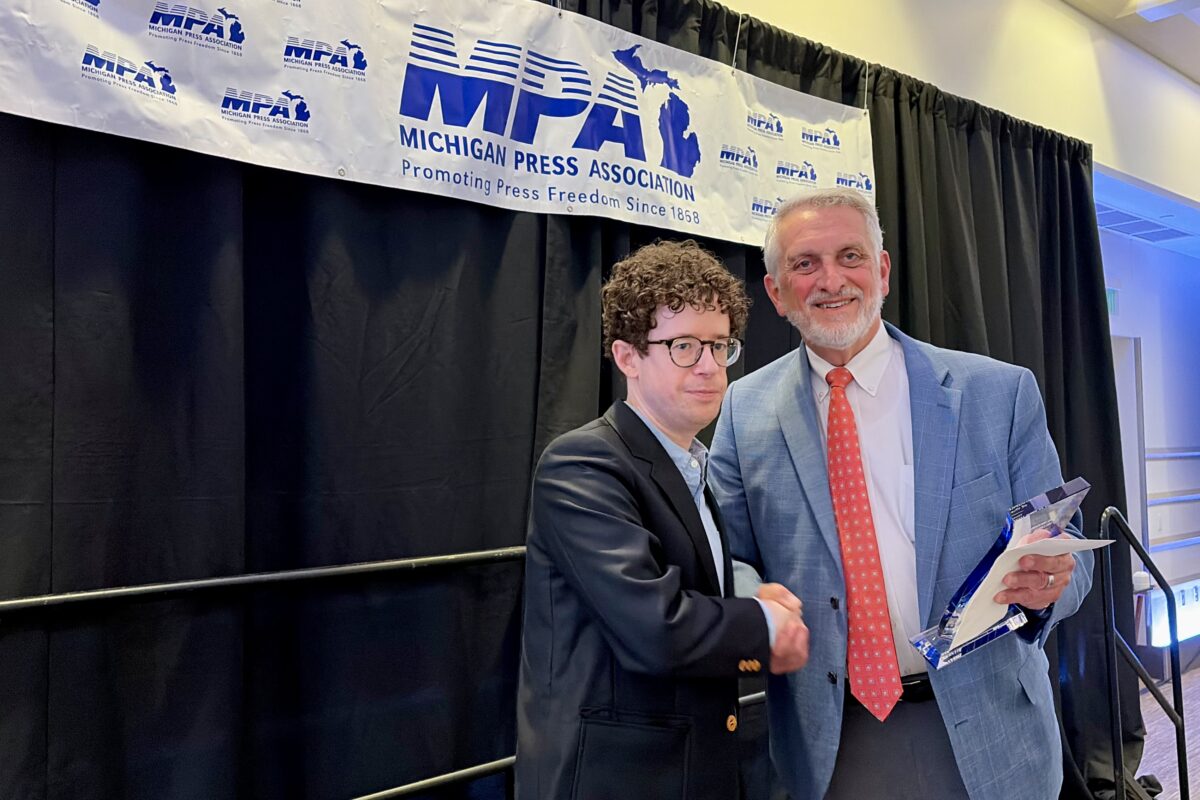 Planet Detroit's Brian Allnutt receives the Michigan Press Association's Journalist of the Year award.