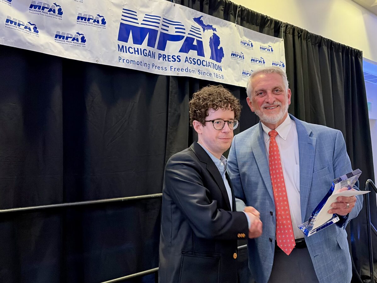Planet Detroit's Brian Allnutt receives the Michigan Press Association's Journalist of the Year award.