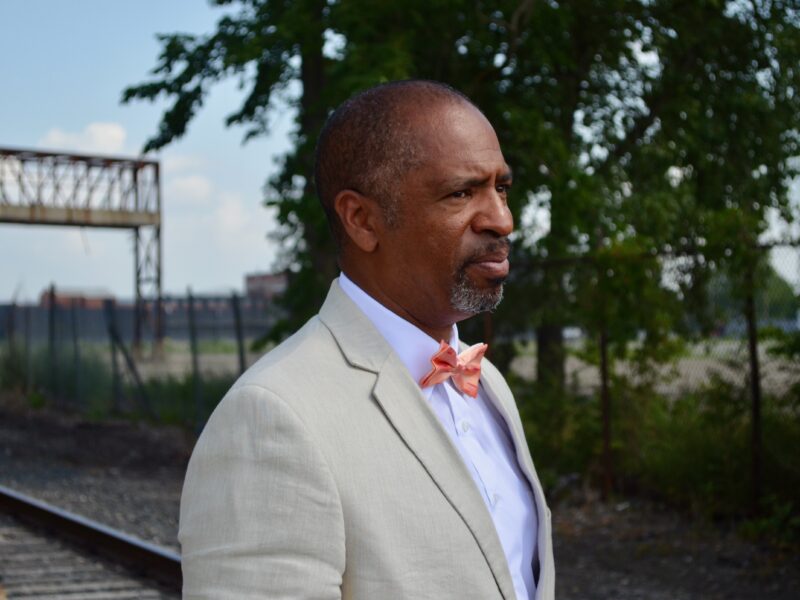Detroit City Council Member Scott Benson stands outside the Packard Plant site.