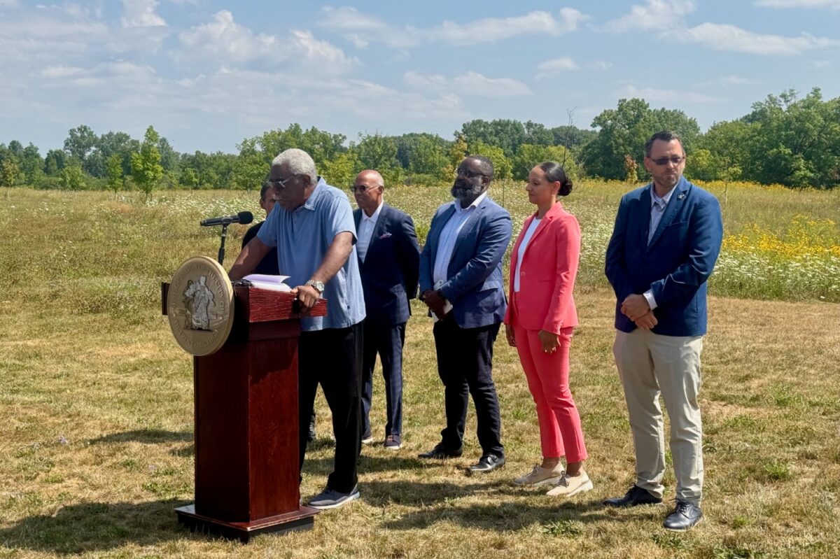 Arthur Edge, president of the Far West Detroit Civic Association and retired city building inspector, speaks at the unveiling of a green stormwater infrastructure project in Rouge Park.