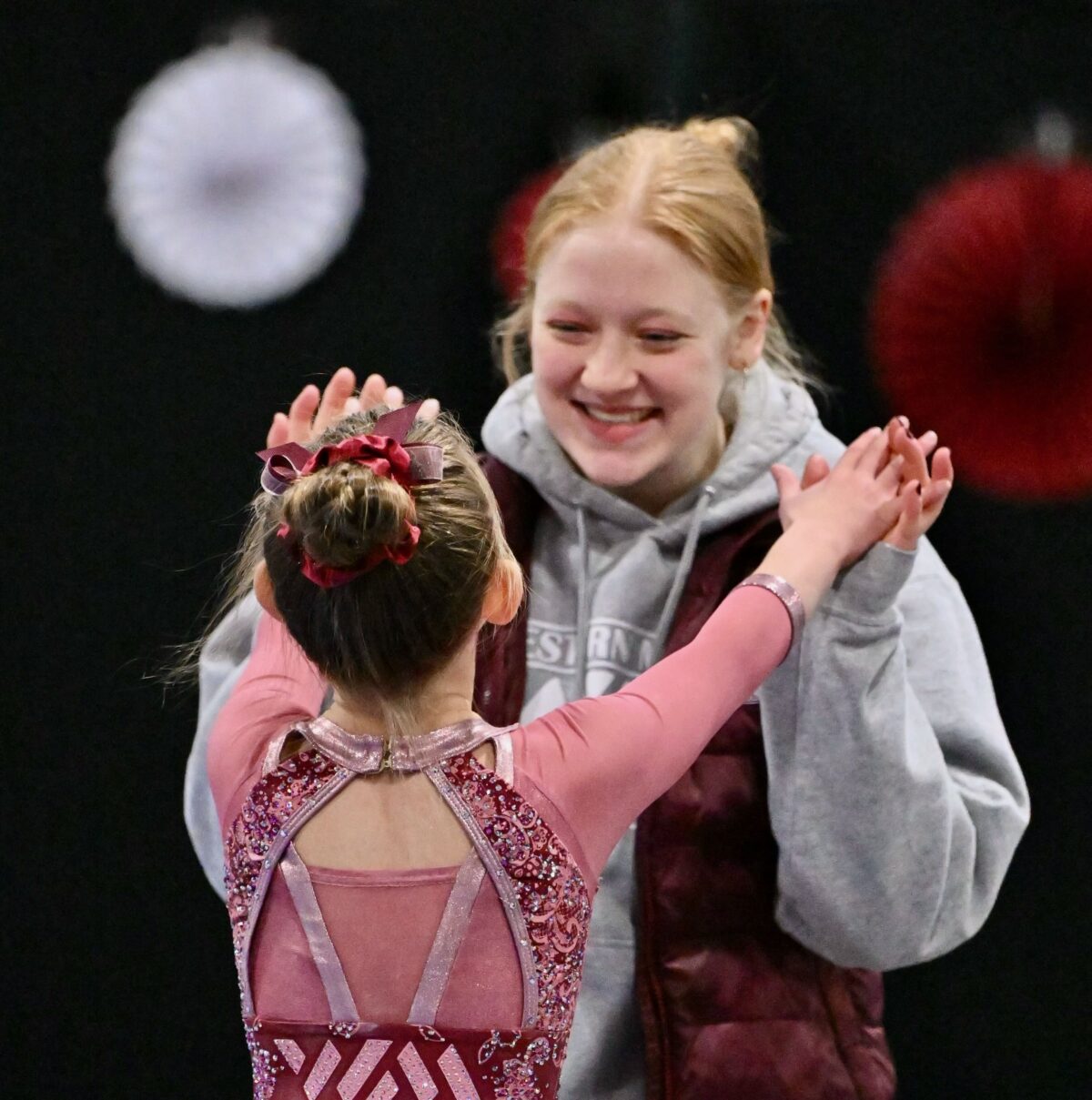 Sports counselor Laurie Miller coaches a competitive gymnast.