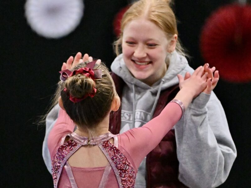 Sports counselor Laurie Miller coaches a competitive gymnast.