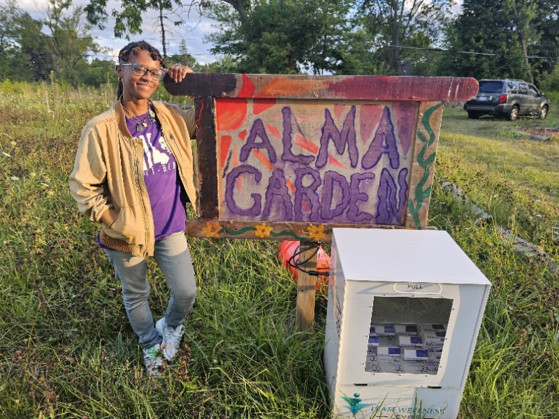 Detroit resident turns vacant lot into community hub with food, books, and overdose prevention resources